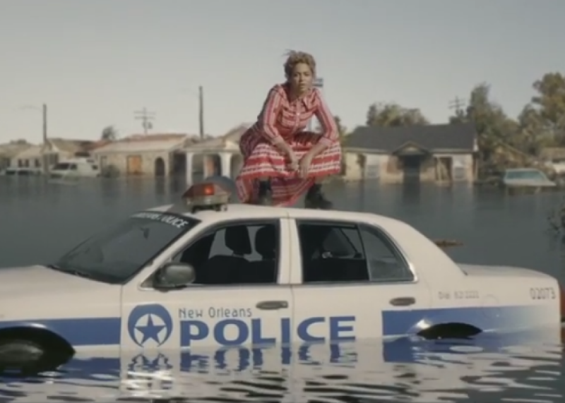 An image from Beyoncé's music video where she shows clips and footage from the damage of Hurricane Katrina